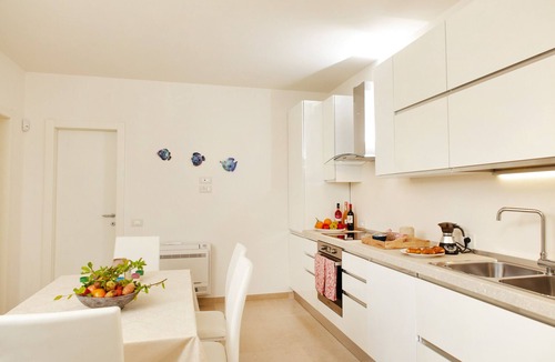 Marina di Felloniche Villa | Modern 2-unit villa with heated pool and seaview