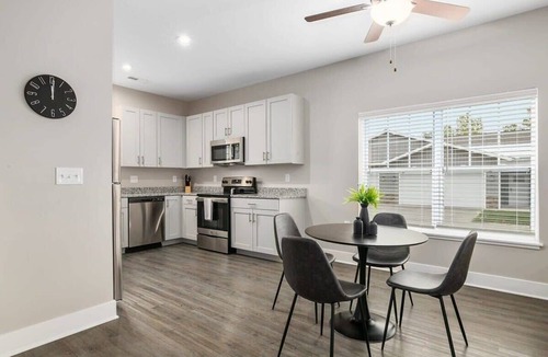 Grandville Apartment | Modern 4BR 4BA Two Unit Condo w Garage and Patio