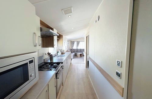 Bleadon House | Modern and contemporary 12ft-wide caravan with two twin.