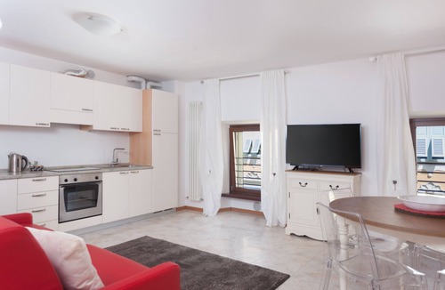 Riva del Garda Apartment | Modern, Centrally Located Apartment "RivApartmentsDowntowN - Love" with a View of the Old Town of Riva del Garda, A/C & Wi-Fi