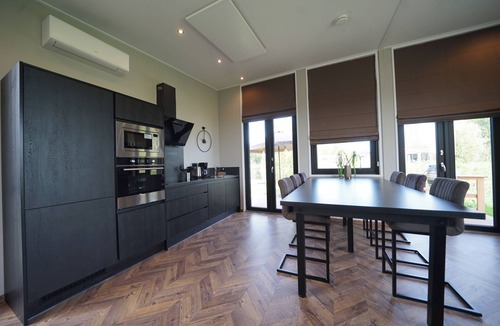 Kampen House | Modern chalet with exceptional lake and river views, private garden and fenced p