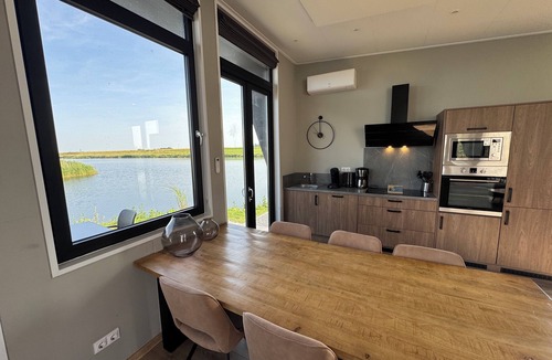 Kampen House | Modern chalet with exceptional lake and river views, private garden and fenced p