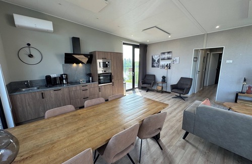 Kampen House | Modern chalet with exceptional lake and river views, private garden and fenced p