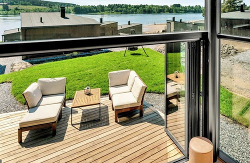 Nes Municipality House | Modern comforts and river views at Oppaker