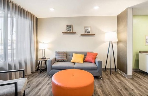 Bellflower Hotel | Modern Comforts in a Charming Locale! Full Kitchen, Pets Allowed, Free Parking!