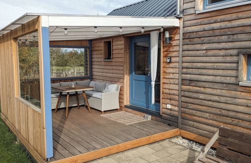 Thaining House | Modern, cozy tiny house with covered terrace