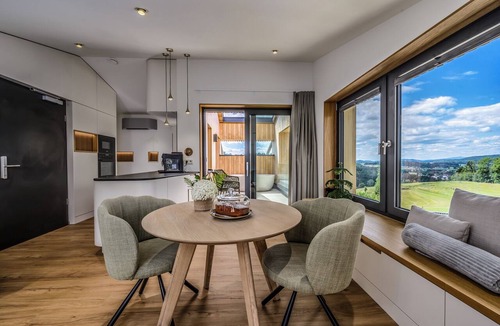 Breitenberg Apartment | Modern design apartment with a view of the Dreisesselberg. With sauna, roof terrace, outdoor bathtub and custom-made furnishings. Perfect for two adults who appreciate peace and quality.