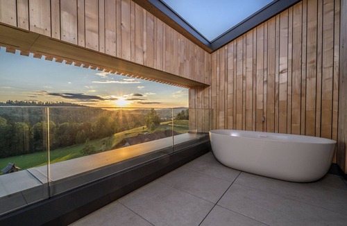 Breitenberg Apartment | Modern design apartment with a view of the valley. With sauna, roof terrace, outdoor bathtub and custom-made furnishings. Perfect for two adults who appreciate peace and quality.