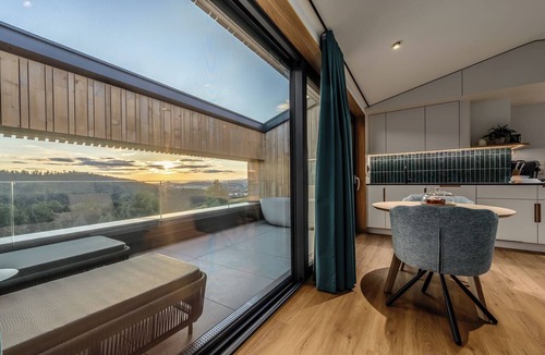 Breitenberg Apartment | Modern design apartment with a view of the valley. With sauna, roof terrace, outdoor bathtub and custom-made furnishings. Perfect for two adults who appreciate peace and quality.