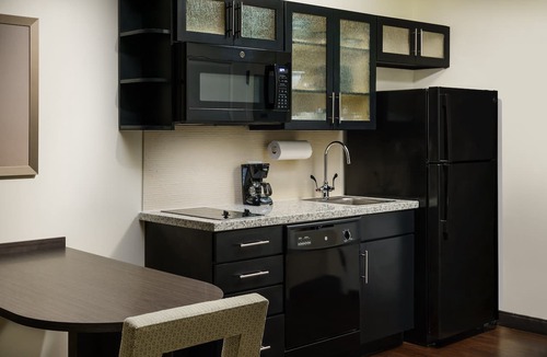 Florida Central Atlantic Coast Hotel | Modern Double Queen Studio | Kitchen & Grill | 3 mi to Typhoon Lagoon