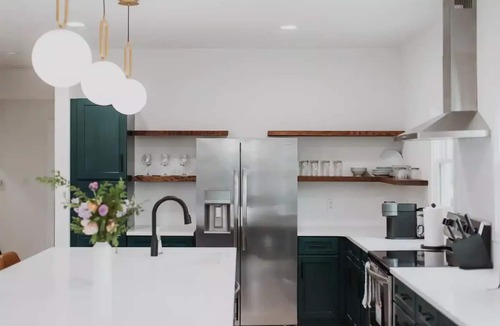 Fletcher Place Apartment | Modern Downtown Indy Apt - King Bed, Patio & Cute Flower Shop Below