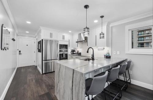 Myrtle Beach Apartment | Modern Escape - Luxe Oceanfront 2BR with Epic Kitchen, Pool, Parking
