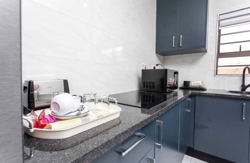 Gaborone Apartment | Modern Executive Studio, Wi-Fi,Smart TV, Washer-Dryer, Equipped Kitchen, Parking