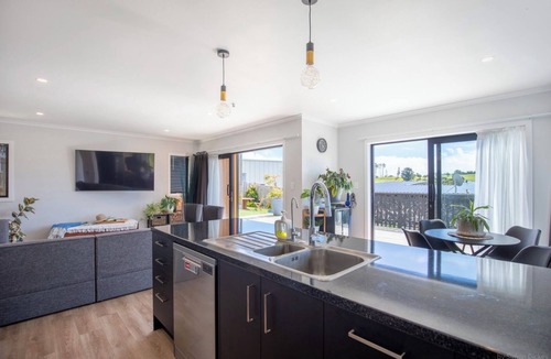 Raglan House | Modern Family-Friendly Sunny Raglan Bach with Spa Pool, BBQ & Large Deck