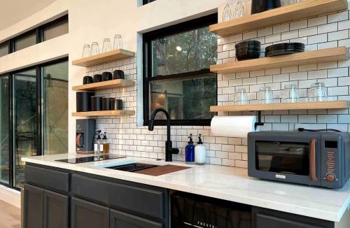 Cedar Creek House | Modern Farmstay Cabin with Friendly Animals, Pond Views & Nature Trails Near Cedar Creek, Texas