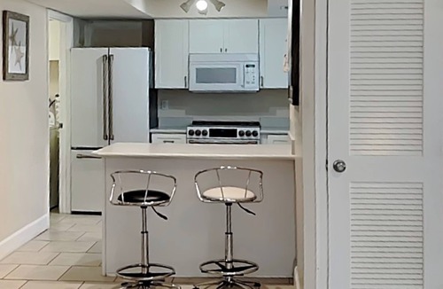 Butler Beach Condo | Modern First-floor Condo with Pool, Porch, Beach Access.
