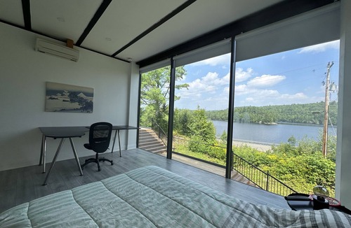Algonquin Highlands Cottage | Modern Glass Cottage facing Lake with Hot tub