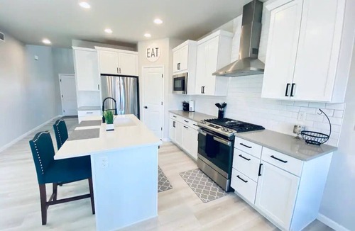 Milliken House | Modern home with a large fenced yard, and garage access