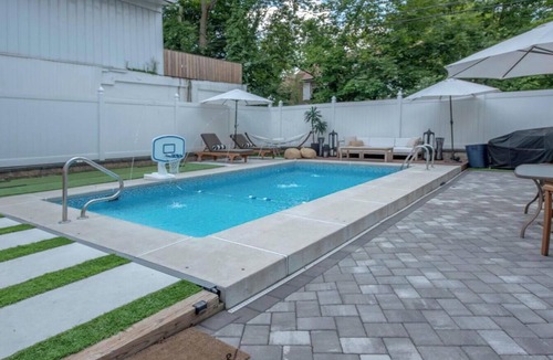 Highland Park House | Modern Home with Heated Pool near Rutgers, train to NYC