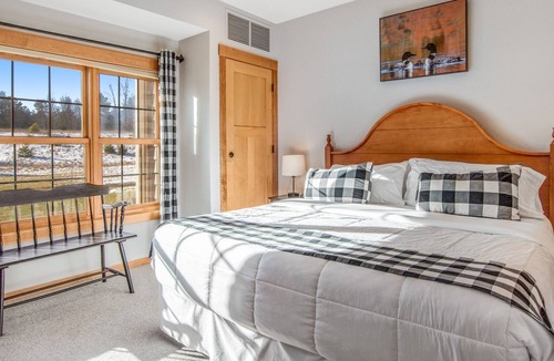 Three Lakes Condo | Modern lakefront condo with grill, W/D, gas fireplace, indoor pool, & hot tubs