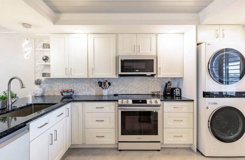 Jupiter Condo | Modern Luxury, Waterfall, Pool, 1/2 mile to Beach