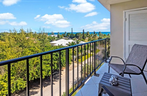 Williams Town Apartment | Modern Oceanview Retreat- Pool, Bar, Restaurant, Salon/Spa!
