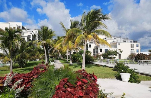 Williams Town Apartment | Modern Oceanview Retreat- Pool, Bar, Restaurant, Salon/Spa!
