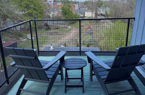 Warwick Apartment | Modern penthouse suite in a restored grain tower with private roof deck.