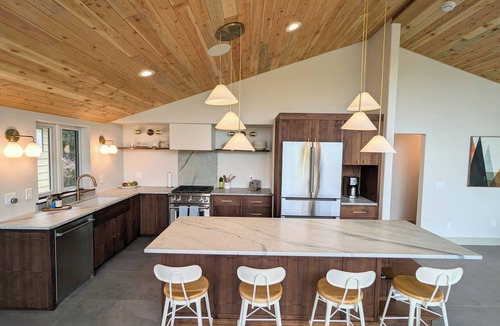 Hamma Hamma House | Modern retreat with serene canal, forest, and mountain views.