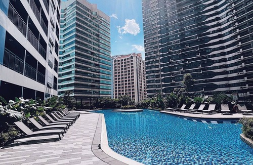 San Antonio Condo | Modern rustic 1-BR condo with balcony at Air Residences Makati
