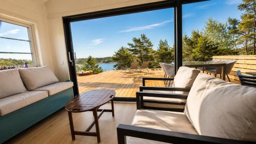 Stromstad House | Modern Scandinavian cabin by the sea, calm, private setting, 50m to ocean
