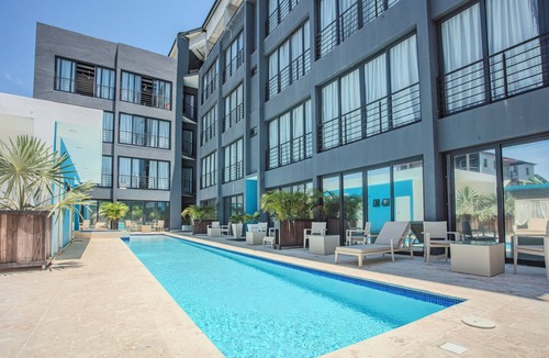 El Batey Apartment | Modern Sosúa Studio at Rizz Suites – Pool, A/C & Walk to Beach