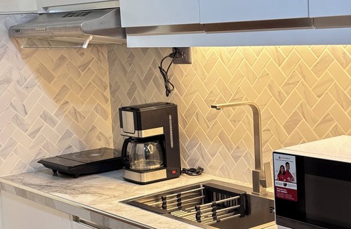 Bagumbayan Condo | Modern spacious studio with pool & stunning city view in Quezon City