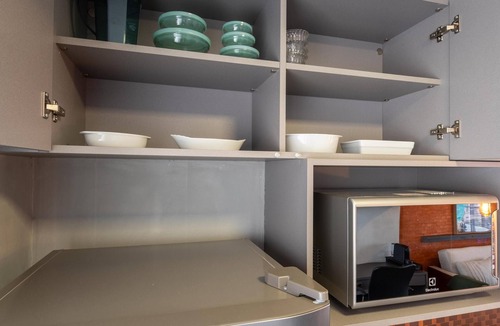 Osasco Apartment | Modern studio apartment with queen-size bed in Cityplex Osasco.