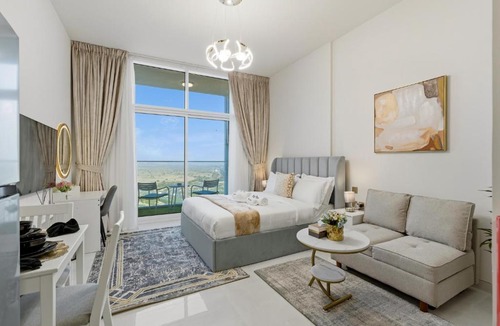 Al Barsha Apartment | Modern Studio on 27th Floor with Miracle Garden Views