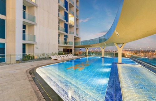 Al Barsha Apartment | Modern Studio on 27th Floor with Miracle Garden Views