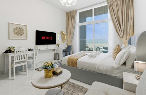 Al Barsha Apartment | Modern Studio on 27th Floor with Miracle Garden Views