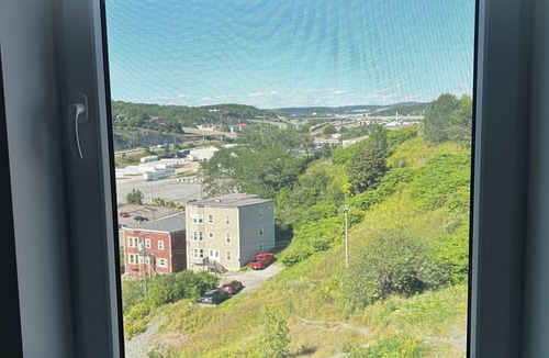 Saint John Apartment | Modern Uptown Gem AC, Gym, & Free Parking Near Saint Joseph’s hospital
