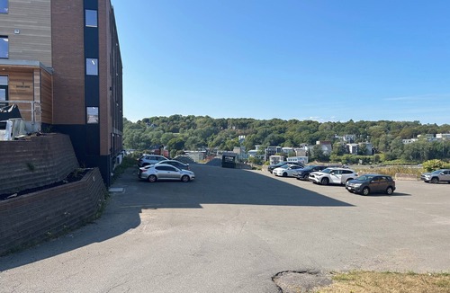 Saint John Apartment | Modern Uptown Gem AC, Gym, & Free Parking Near Saint Joseph’s hospital