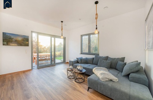 Usedom House | Modern vacation home "Haffhus" for up to 10 people with garden and balcony