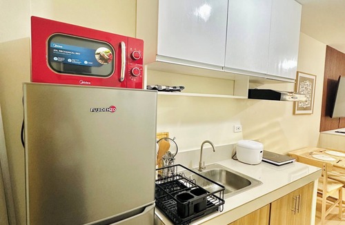 Dumaguete Condo | Modest Condo Getaway, Sea & City Access