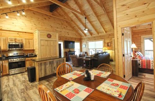 Bryson City Villa | Moose Tracks Downtown Veranda Level Cabin with Hot Tub