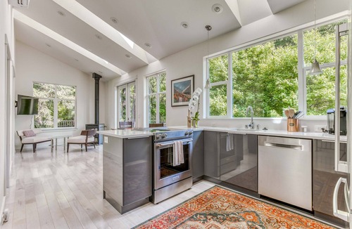 Stevenson House | Mountain and river-view home & studio with fireplace, grills, outdoor areas