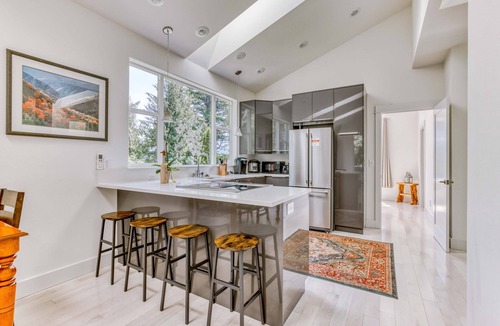 Stevenson House | Mountain and river-view home & studio with fireplace, grills, outdoor areas