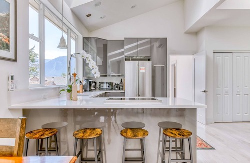Stevenson House | Mountain and river-view home & studio with fireplace, grills, outdoor areas