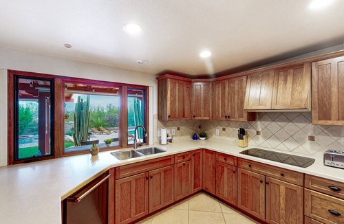 The Foothills House | Mountain view escape with an enclosed yard, pool, hot tub, grill, & AC - dogs ok