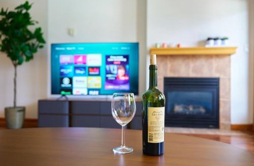 Canmore Apartment | Mtn View Escape with King Size Bed with Outdoor Pool - Banff Pass Included!