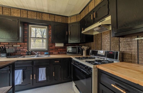 Cheboygan Cabin | Mud Creek Cottage waterfront acre lot & game-room