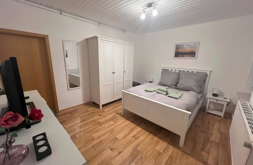 Stinstedt House | "Naturblick" House with foosball, darts, an electric vehicle charging station, and a barrel sauna—sustainable vacations