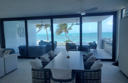 Blue Hills Villa | New BEACHFRONT Aqua Blu Villa-4 King Bdrm/6 Bath-Oceanfront bliss-up to 8 guests